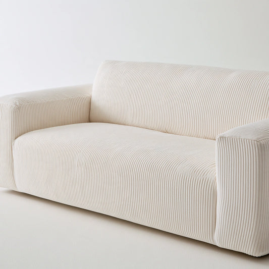 Modern sofa in broken white color by theentryandexit, close-up studio shot showing soft fabric and sleek contemporary design.