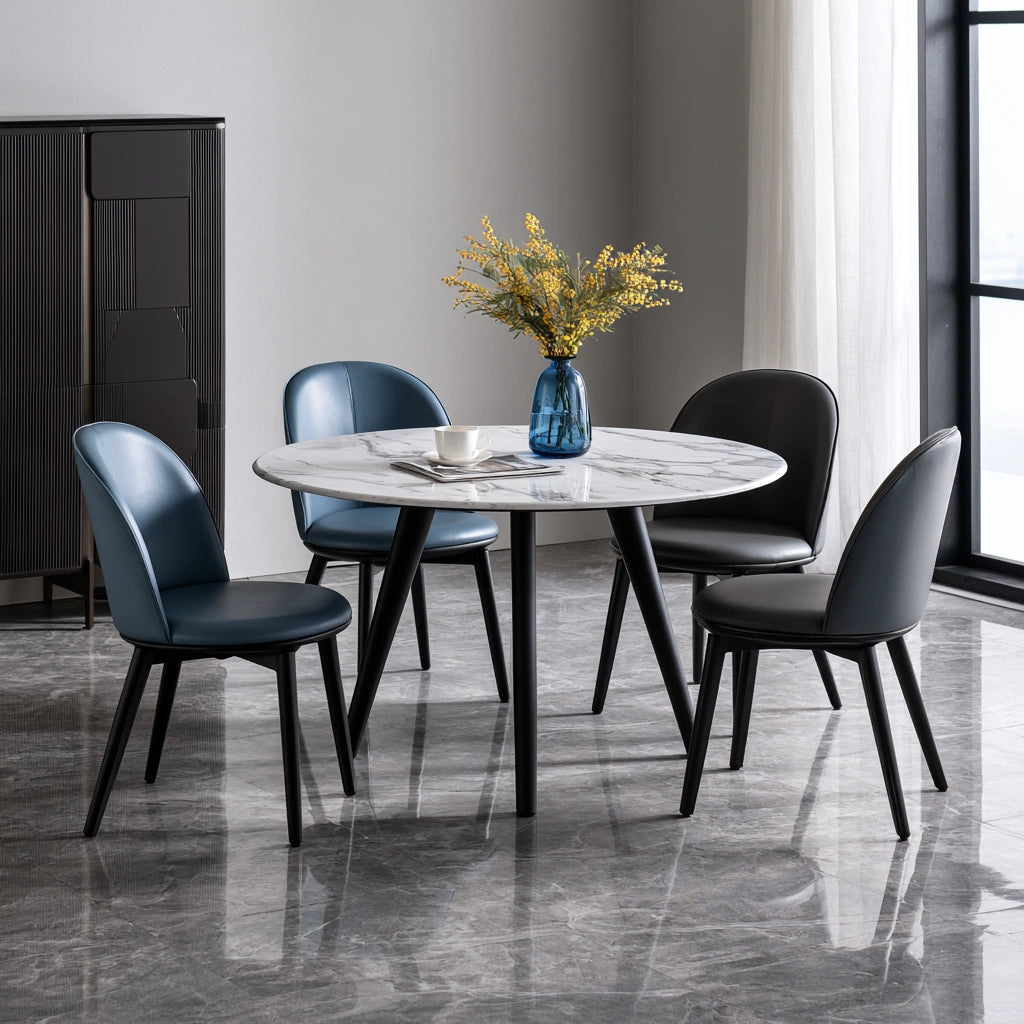 White dining set with round marble-patterned table and four matching chairs, modern design from theentryandexit for home and dining spaces.