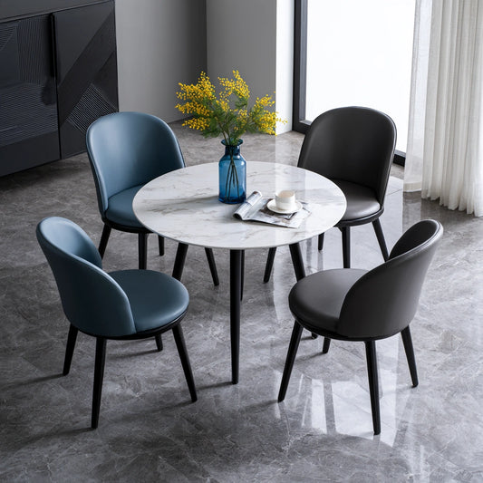 White dining set with round marble-patterned table and four matching chairs, featuring a stylish faux marble finish.