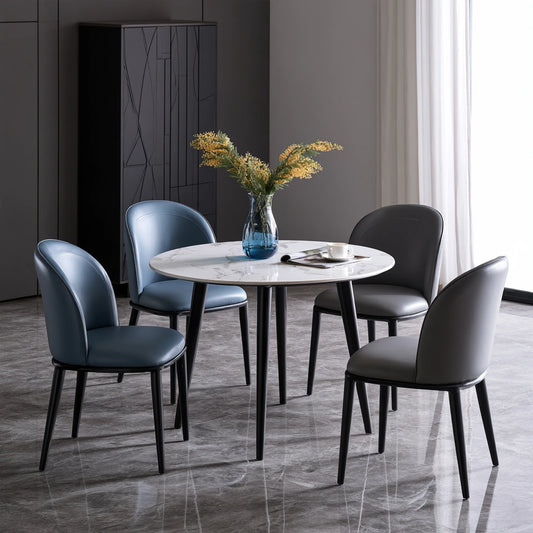 White dining set with marble-patterned table and four matching chairs, stylish and modern for home and dining room use.
